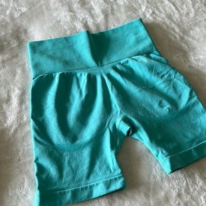 SHEIN workout shorts in green/teal